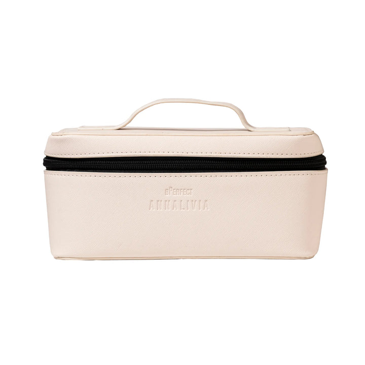Beige travel case with black trim on a white background