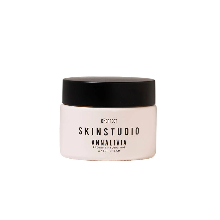 Skincare jar with black lid on a white background