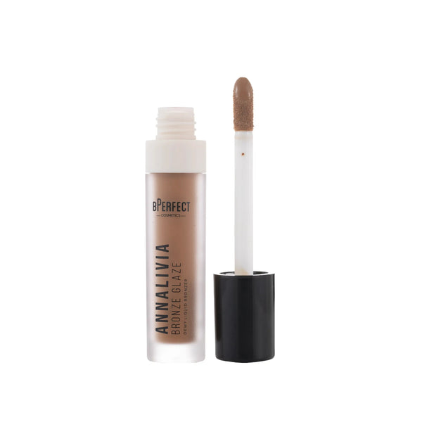 Cosmetic product with applicator on a white background