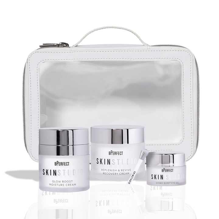 Three skincare jars with a transparent white pouch on a white background