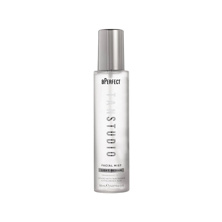 Facial mist bottle with silver top and white label on a white background