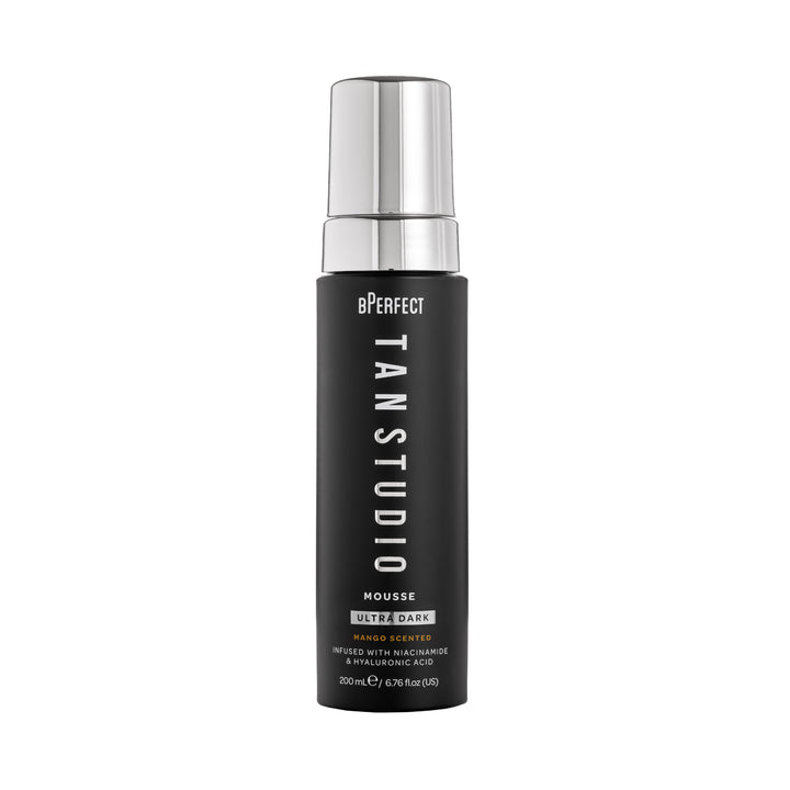 Black bottle of bPerfect Tan Studio Mousse with silver cap on a white background