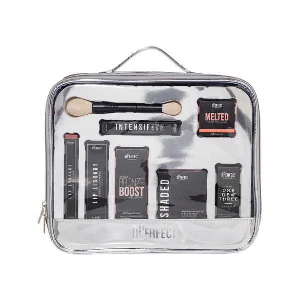 Makeup kit with various products in a silver travel case on a white background