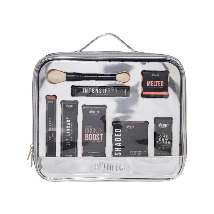 Makeup kit with various products in a silver travel case on a white background